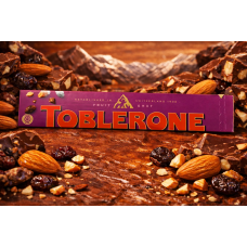 Шоколад Toblerone  молочна з родзинками та мигдалем   100гр 